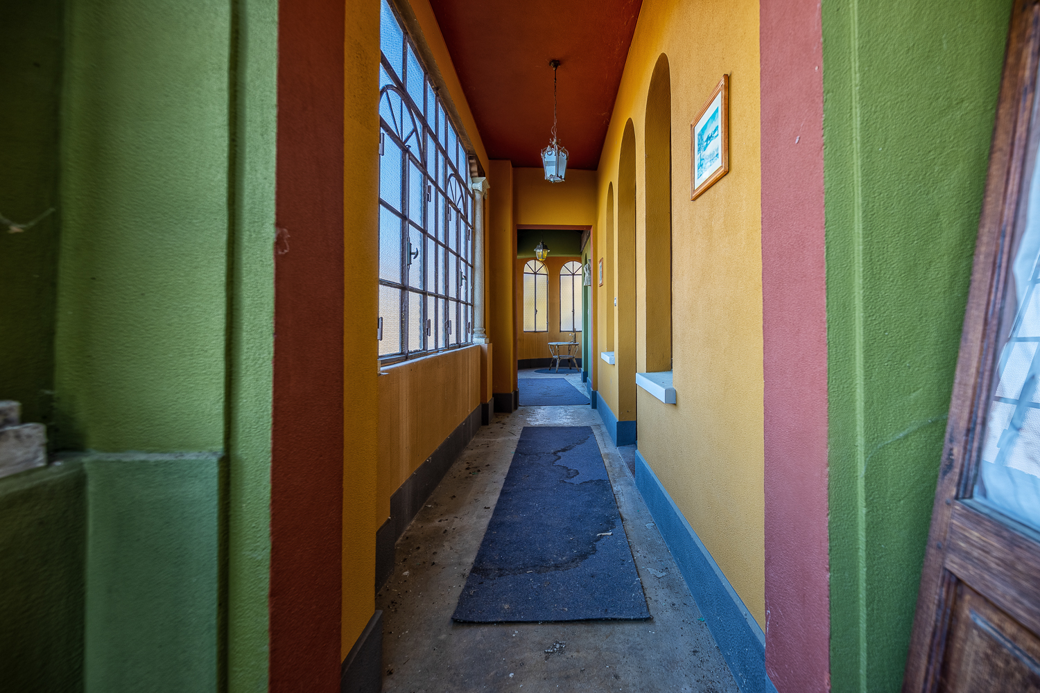 The Red Staircase of an Abandoned Villa in Italy